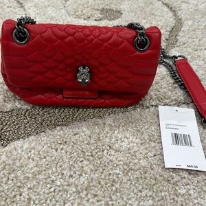 NWT Betsy Johnson red hand bag. Perfect for the holidays